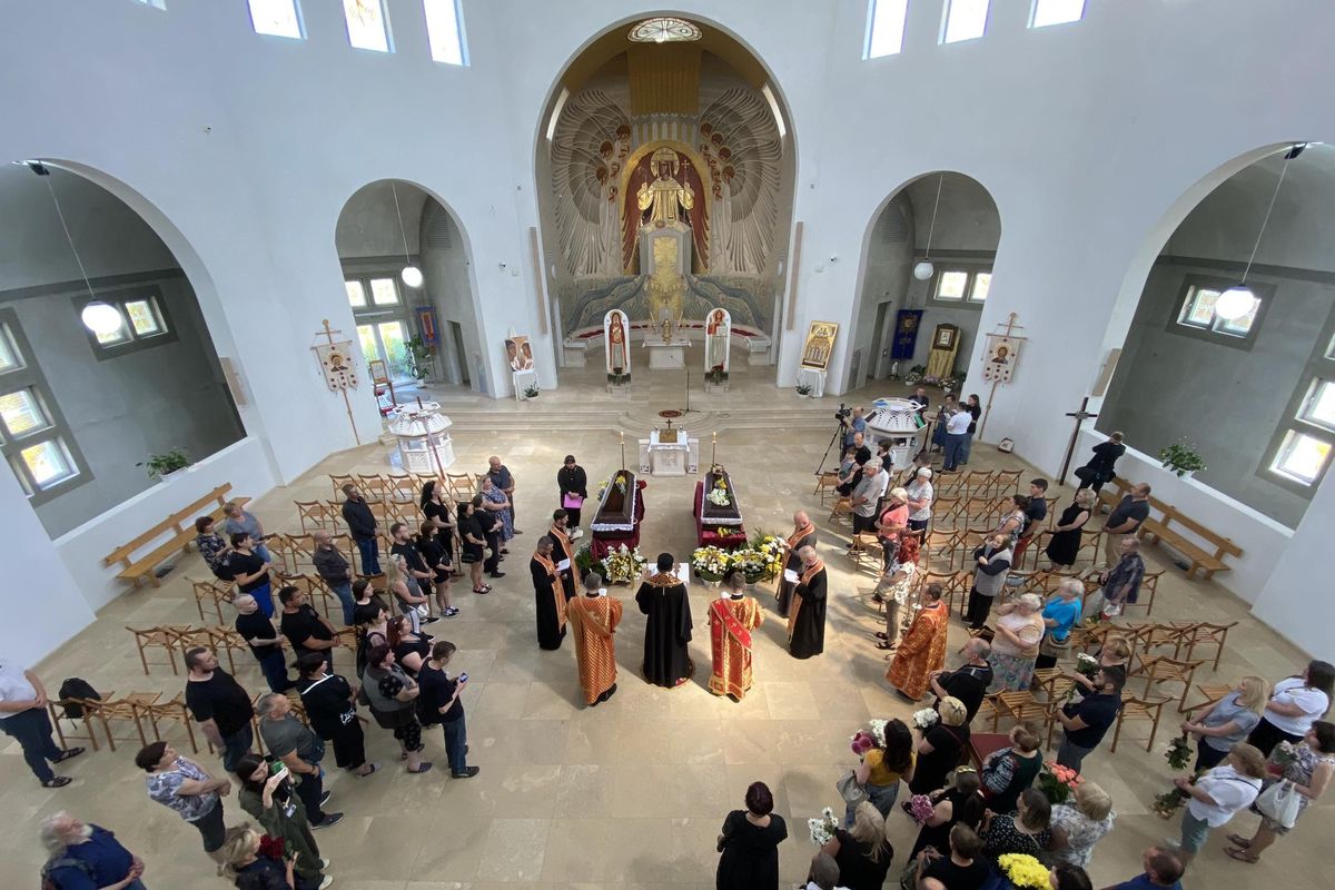 In Lviv, Bishop Volodymyr Hrutsa presides over the funeral service for two people killed in a missile strike